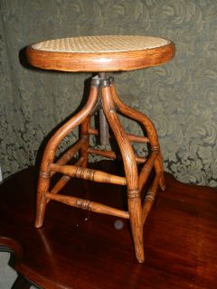 GORGEOUS ANTIQUE OAK BENTWOOD ADJUSTABLE PIANO STOOL W/CANED SEAT
