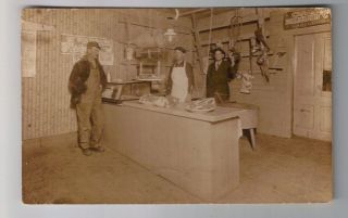 Postcard, Real Photo, Interior of butcher shop with equipment and meat