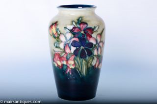 Walter Moorcroft Vase in Spring Flowers design to tonal green ground 