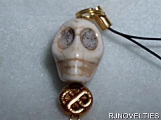 COOL HAND CARVED HOWLITE TURQUOISE SKULL WITH GOLD TONES ZIPPER PULLS