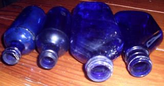 cobalt blue glass bottles, 1 is Phillips Milk of Magnesia