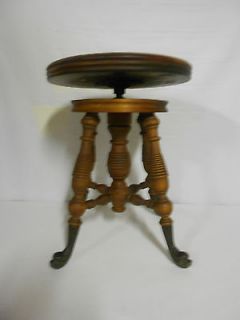 Antique Swivel piano stool with bronze feet