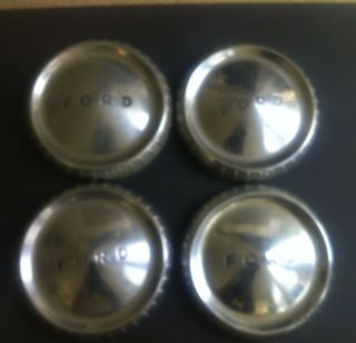 Set of 4 Ford Falcon hubcaps. Metal. Measure about 9 1/2 inches. 1960s