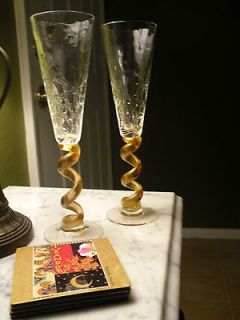 pair of Union Street Glass crystal champaigne flutes with gold stems 