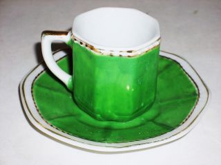 VINTAGE PORCELAIN DEMITASSE CUP AND SAUCER WITH VICTORIAN SCENE