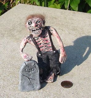 miniature dollhouse fleshy zombie with tombstone from canada time left