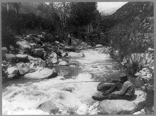 Two men fishing,poles,creek,streams,rivers,rocks,Ontario,California,CA 