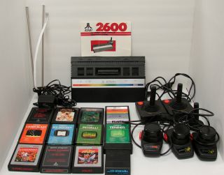 Vintage Atari 2600 2 Joysticks 2 Paddles 1 Driving Controller 12 Games 