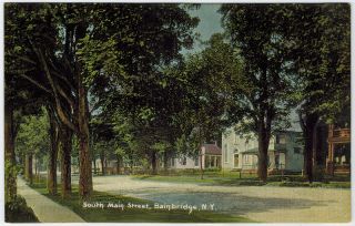   divided back Postcard of South Main Street in Bainbridge, New York NY