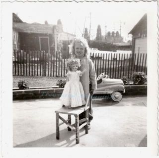 1940s girl playing with doll champion pedal car photo time
