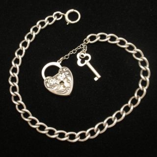 Curb Link Charm Bracelet with Repousse Engraved Padlock Lulu