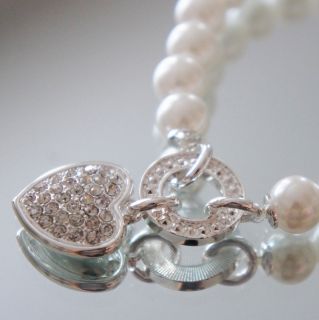 Brand new pearl bead bracelet with rhinestone heart charm. Very lovely 