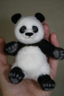 bo is a dry felted panda bear made of pure thin high quality 