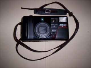 THIS IS A VINTAGE NIKON TELE TOUCH 35MM CAMERA WITH 35/70 LENS IN 