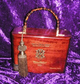 front of opusx cigar box purse back of purse adorned with