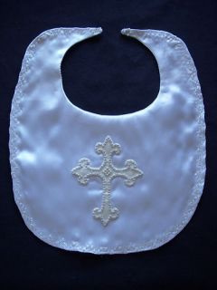 Bib ismade from delicate white satin fabric, embroidered Silver cross 