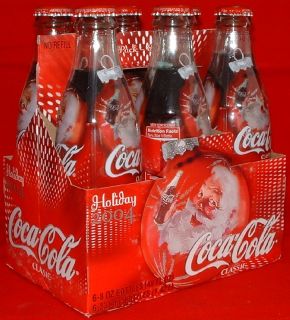 You are bidding on Six Pack of CokeCola 2004 Santa Bottles. The