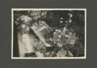 Old woman in casket flowers antique goth funeral post mortem photo