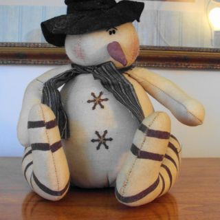 Primitive Whimsy Snowman with a toboggan & bell, measuring 9 tall x