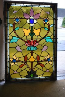 Vintage Stained Glass Window with Floral Pattern Amber Background