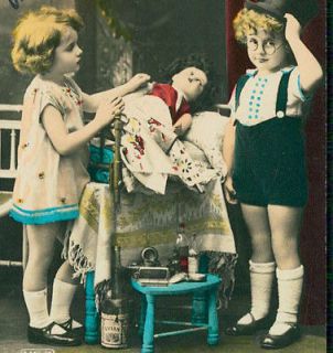 1920s old real photo postcard CHILDREN playing w/DOLL + antique EVIAN