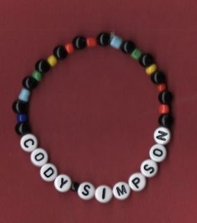 Custom caption bracelet 6mm black & 4mm rainbow mix beads