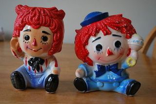 Raggedy Ann and Andy flower pots   6 1/2 inches tall   Ann holding a