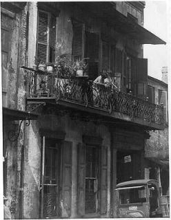 Buildings with Wrought Iron Railings,New Orleans,LA,2 Women on Balcony