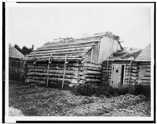 Log cabins,barabara,dwellings,buildings,homes,door,wood,Kodiak,Alaska