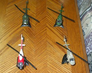 MAISTO TAILWINDS SET OF 4 BELL HELICOPTERS ALL MINT WITH STANDS  BELL
